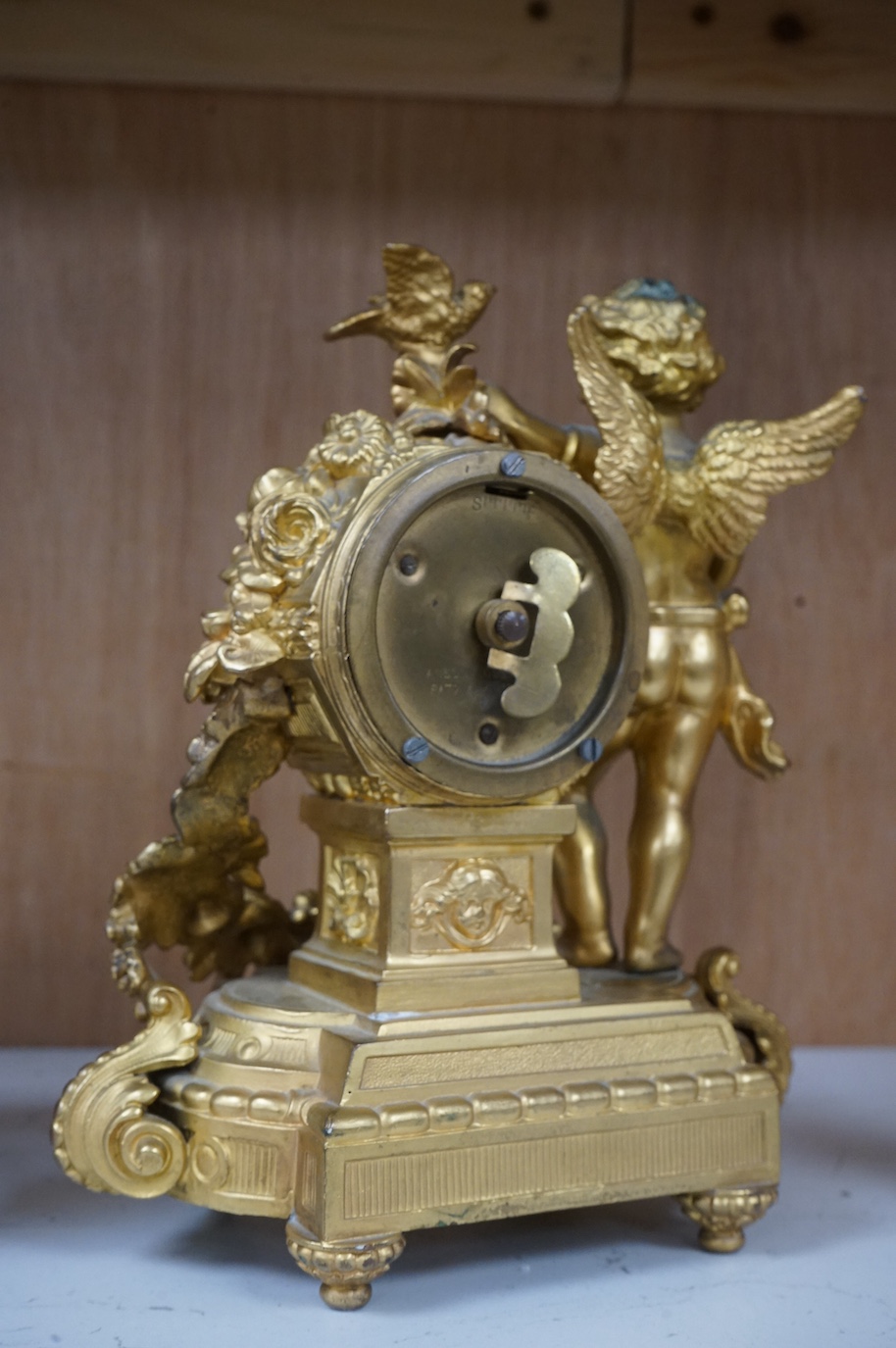 A late 19th century gilt metal cherub timepiece, Ansonia clock company movement, 21cm high